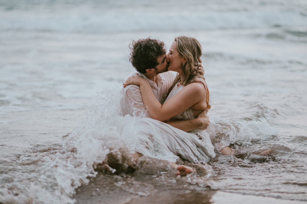 Maui Hawaii Koki Beach Elopement Destination Wedding bride and groom in the ocean waves