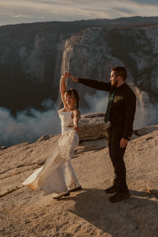 bride and groom dancing at Taft Point in Yosemite