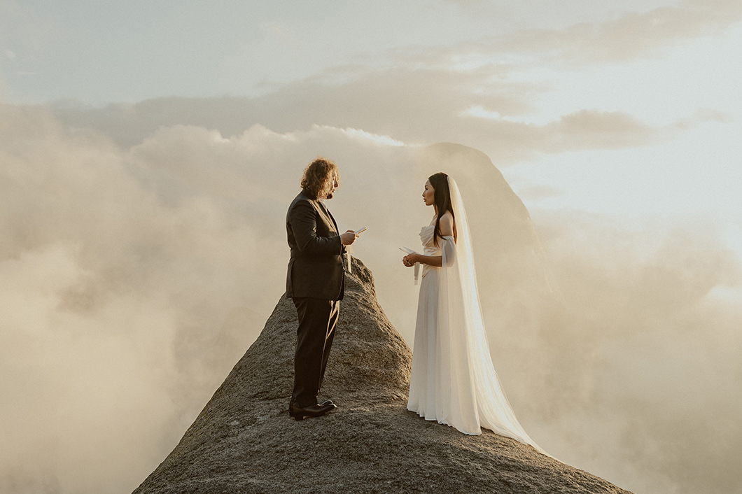 bride and groom exchange vows during sunrise at glacier point in yosemite
